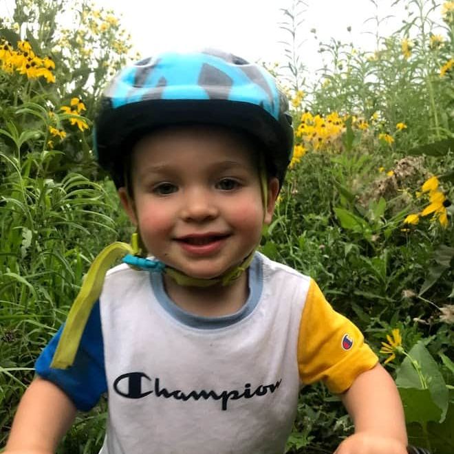 Owen Tudor riding through a field of wildflowers