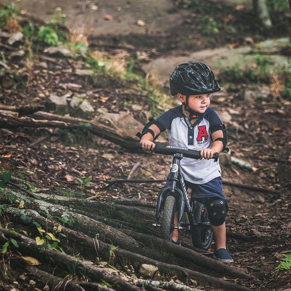 Boy on Strider Bike on singletrack