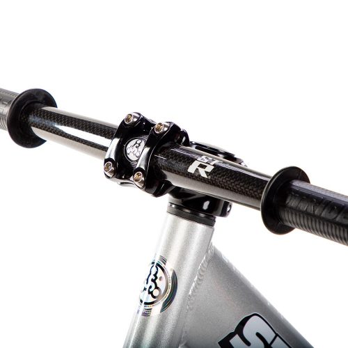 Studio image of silver 12 Pro with Strider ST-R Carbon Fiber Handlebar - close-up angled view